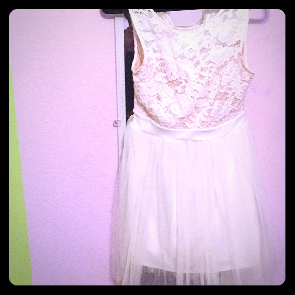 medium-large white knee length homecoming dress.